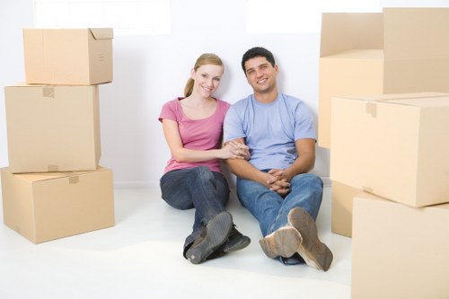 Furniture moving team handling household items in central London