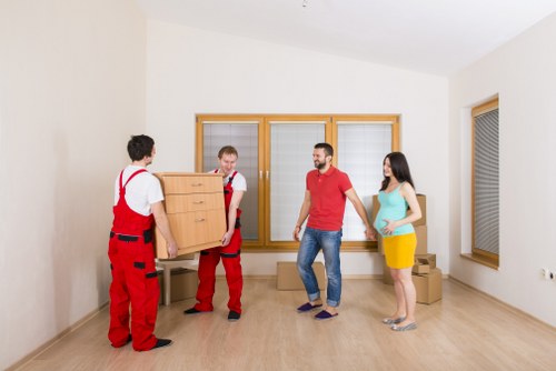 Removal crew handling furniture carefully during a central London move