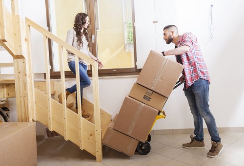 Local office removals team handling equipment near central London streets