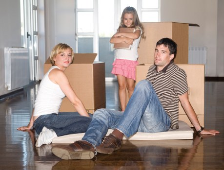 Packed household boxes and furniture ready for loading